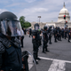 Capitol Police dressed in riot gear watch as activists react to the Supreme Court’s ruling in the Dobbs v Jackson Women’s Health Organization case in front of the U.S. Supreme Court on June 24 in Washington, DC.